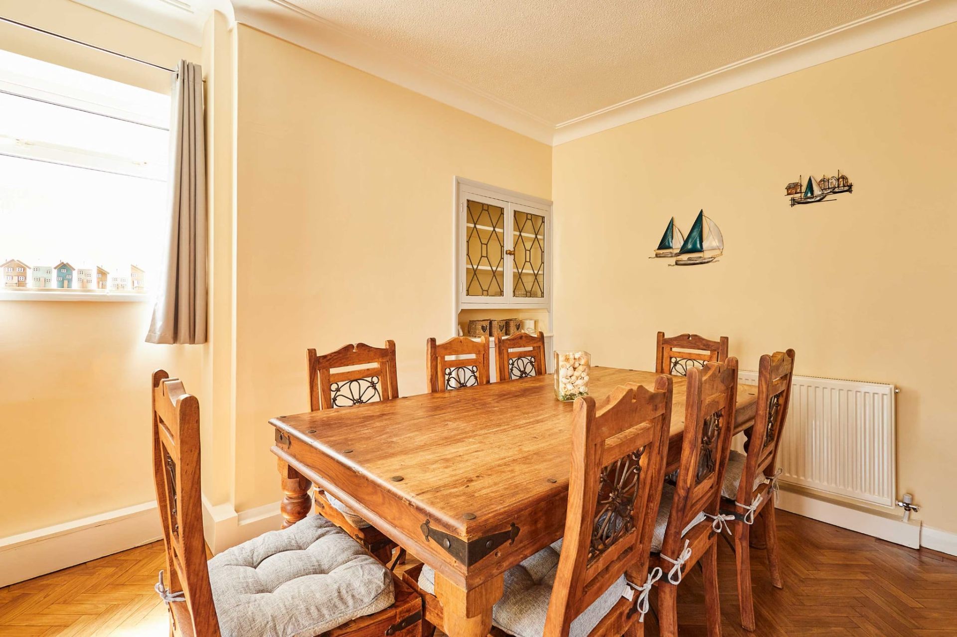 Solid wood dining table seating eight in the Skegness holiday home