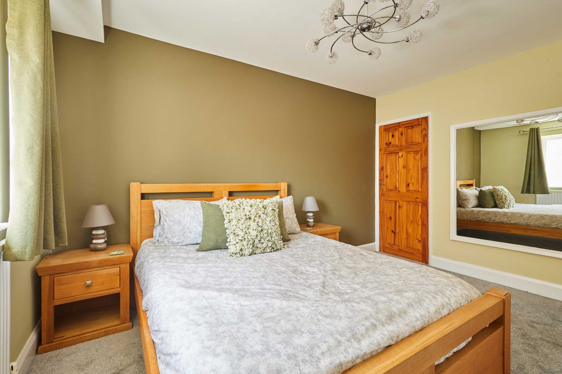 Restful double bedroom with calming olive walls