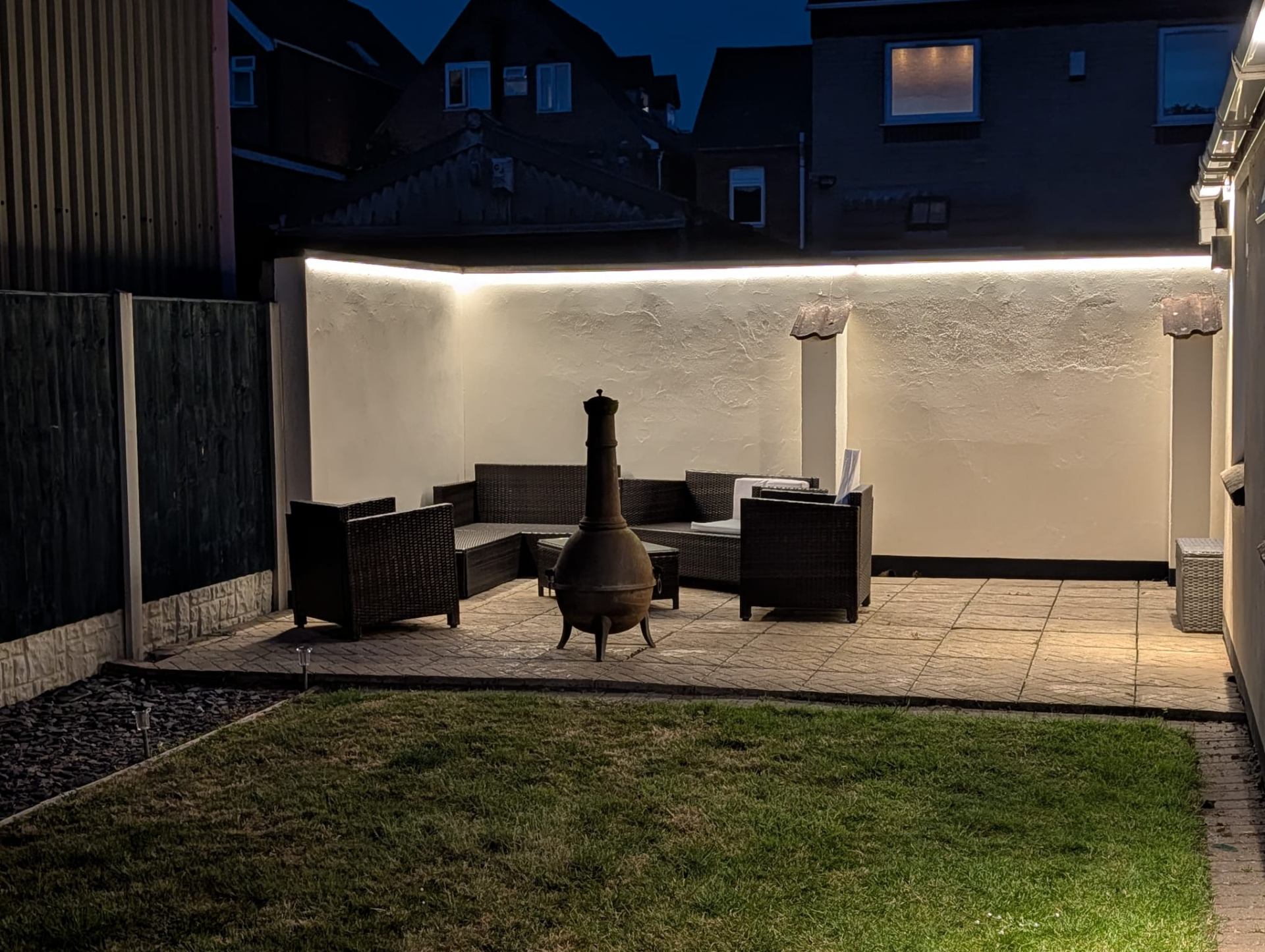 Private patio garden with chiminea at dusk